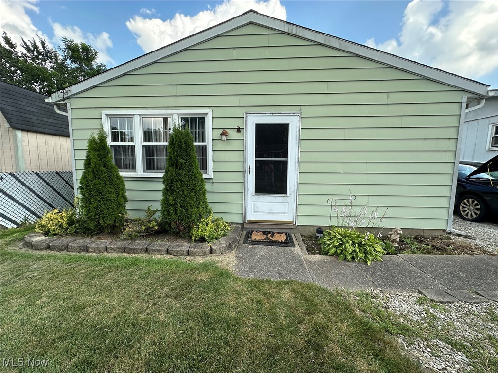 207 Rustic Rook Road Chippewa Lake, OH 44215 - Photo 1 of 1 View of front facade with a front lawn