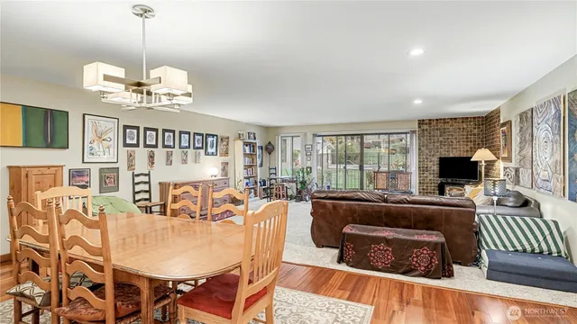 a living room with fireplace furniture and a flat screen tv