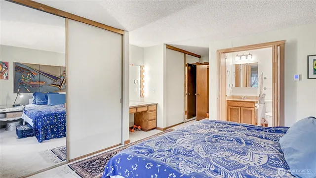 a bedroom with a bed dresser and a window