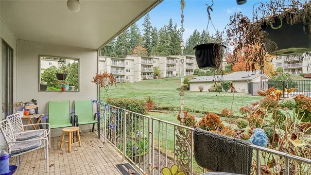 a view of a chair and tables front of the house