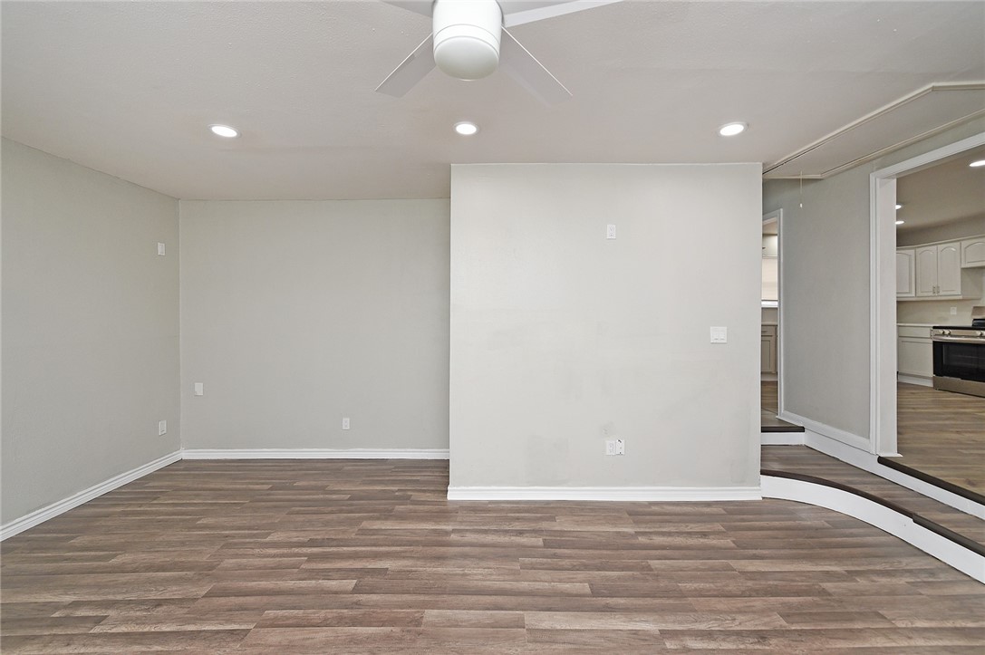 634 Mc Call Street Corpus Christi, TX 78404 - Photo 14 of 34 wooden floor in an empty room with a window
