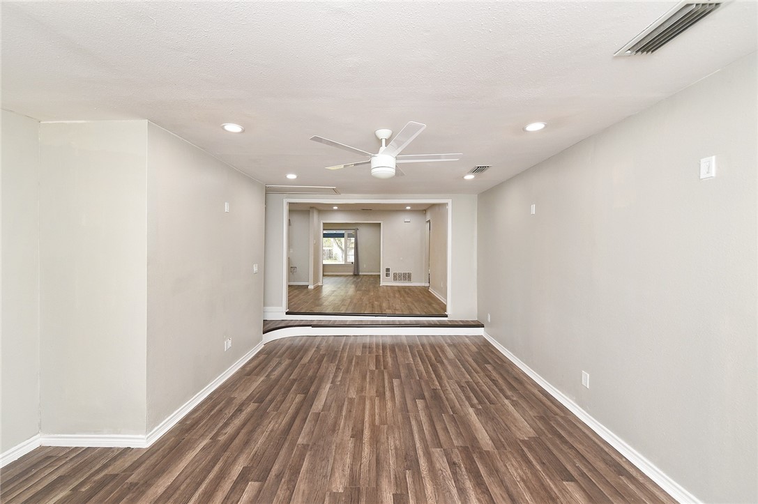 634 Mc Call Street Corpus Christi, TX 78404 - Photo 15 of 34 a view of an empty room with wooden floor and a window