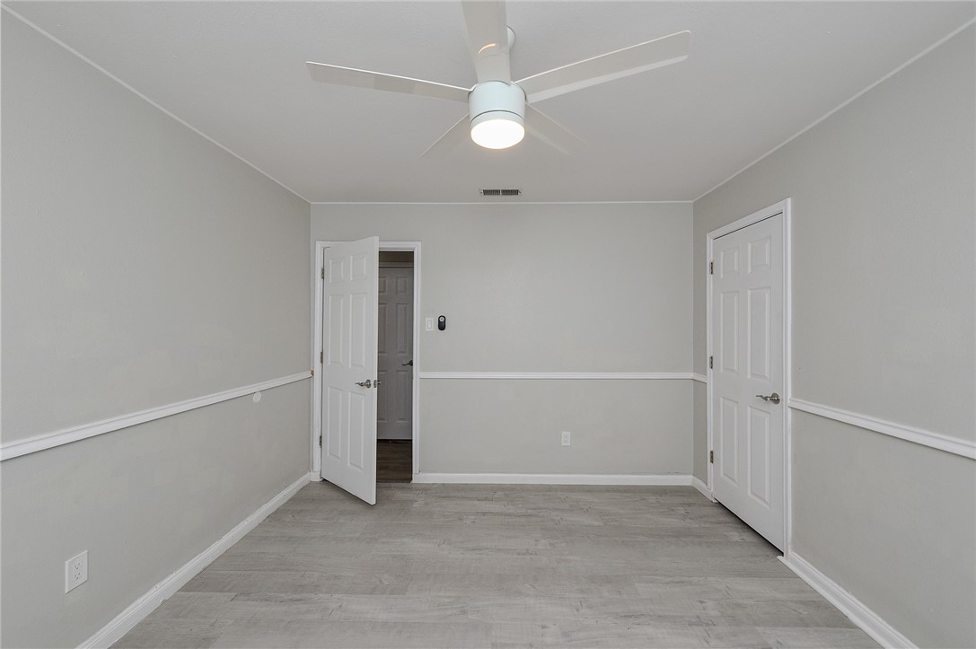 634 Mc Call Street Corpus Christi, TX 78404 - Photo 26 of 34 an empty room with a white walls and entryway