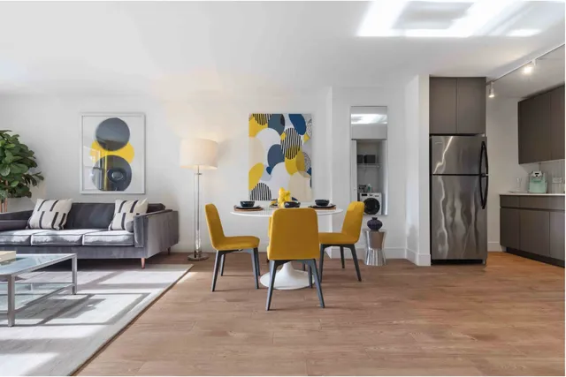 a living room with furniture and a table