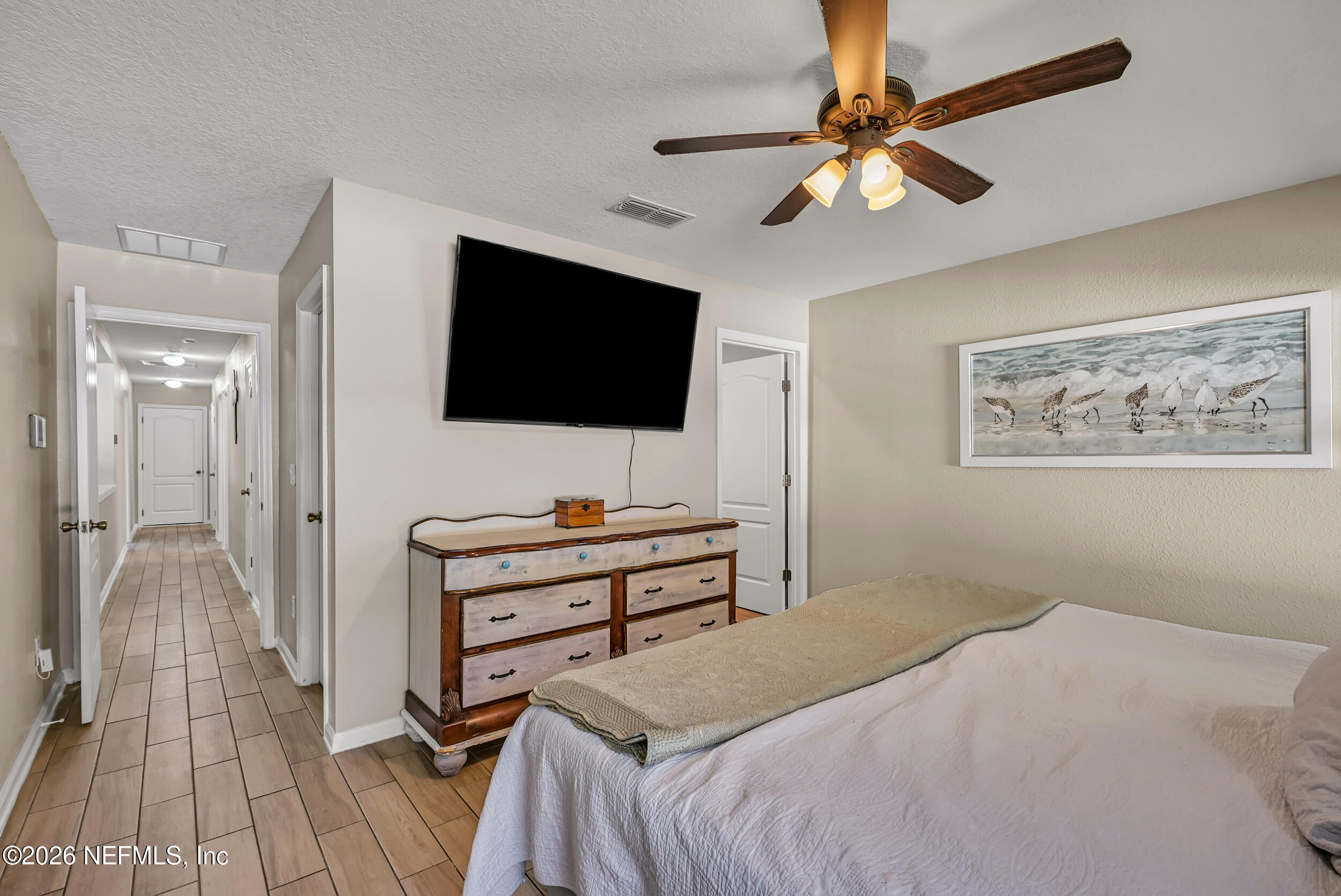 532 Bluejack Lane St. Augustine, FL 32095 - Photo 19 of 55 a bedroom with a bed and a flat screen tv