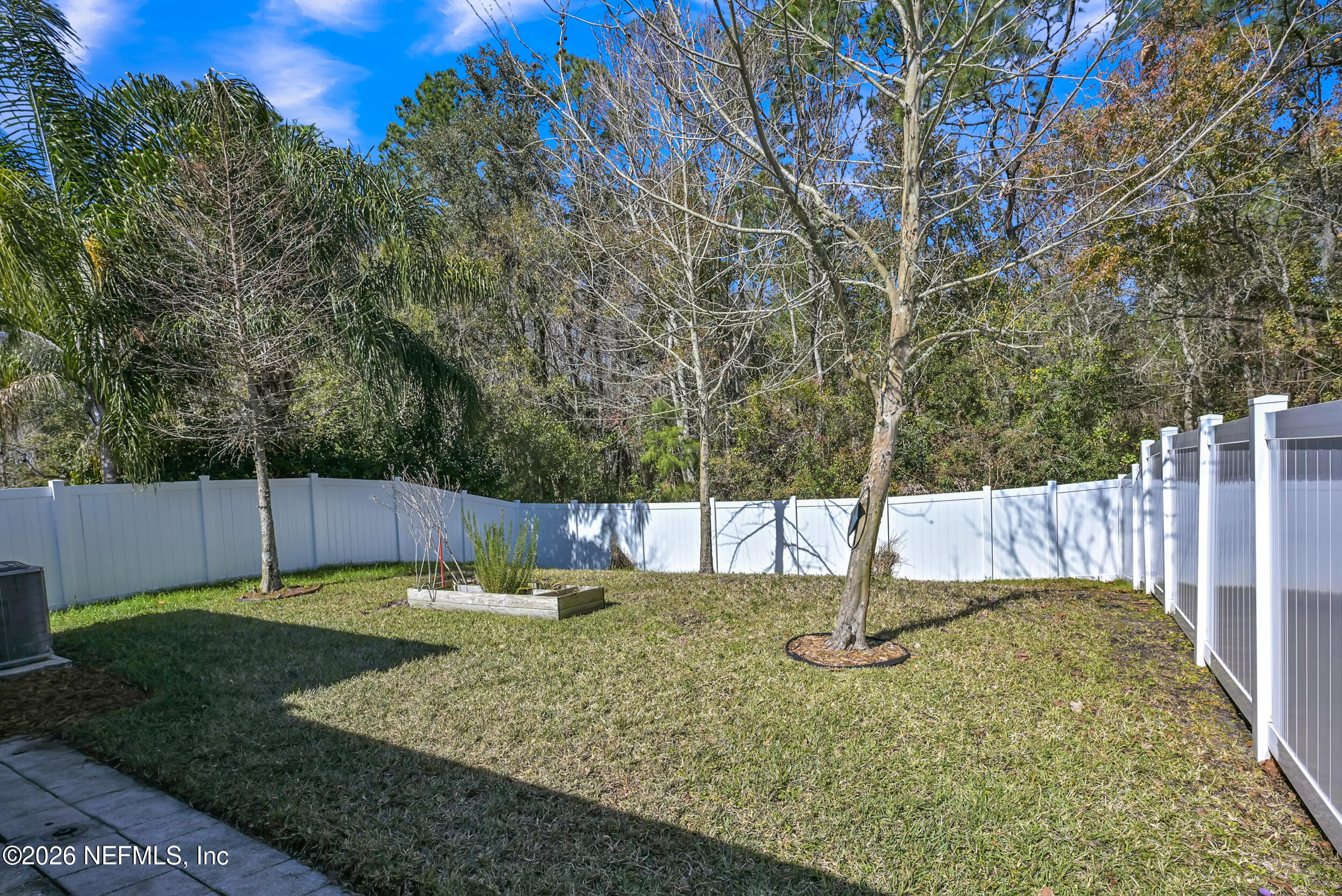 532 Bluejack Lane St. Augustine, FL 32095 - Photo 32 of 55 a view of a backyard with tall trees