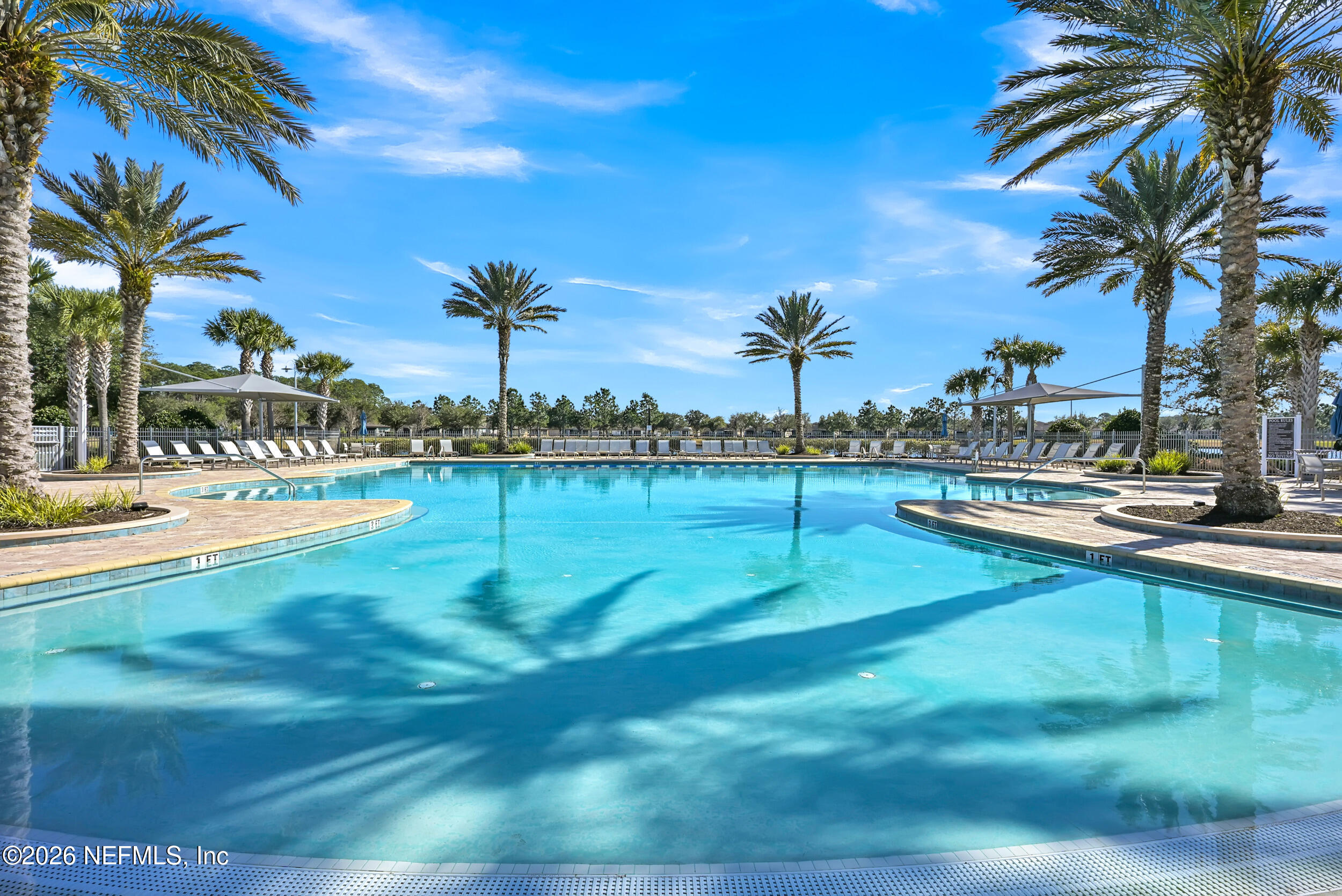 532 Bluejack Lane St. Augustine, FL 32095 - Photo 47 of 55 a view of a swimming pool with a table and chairs