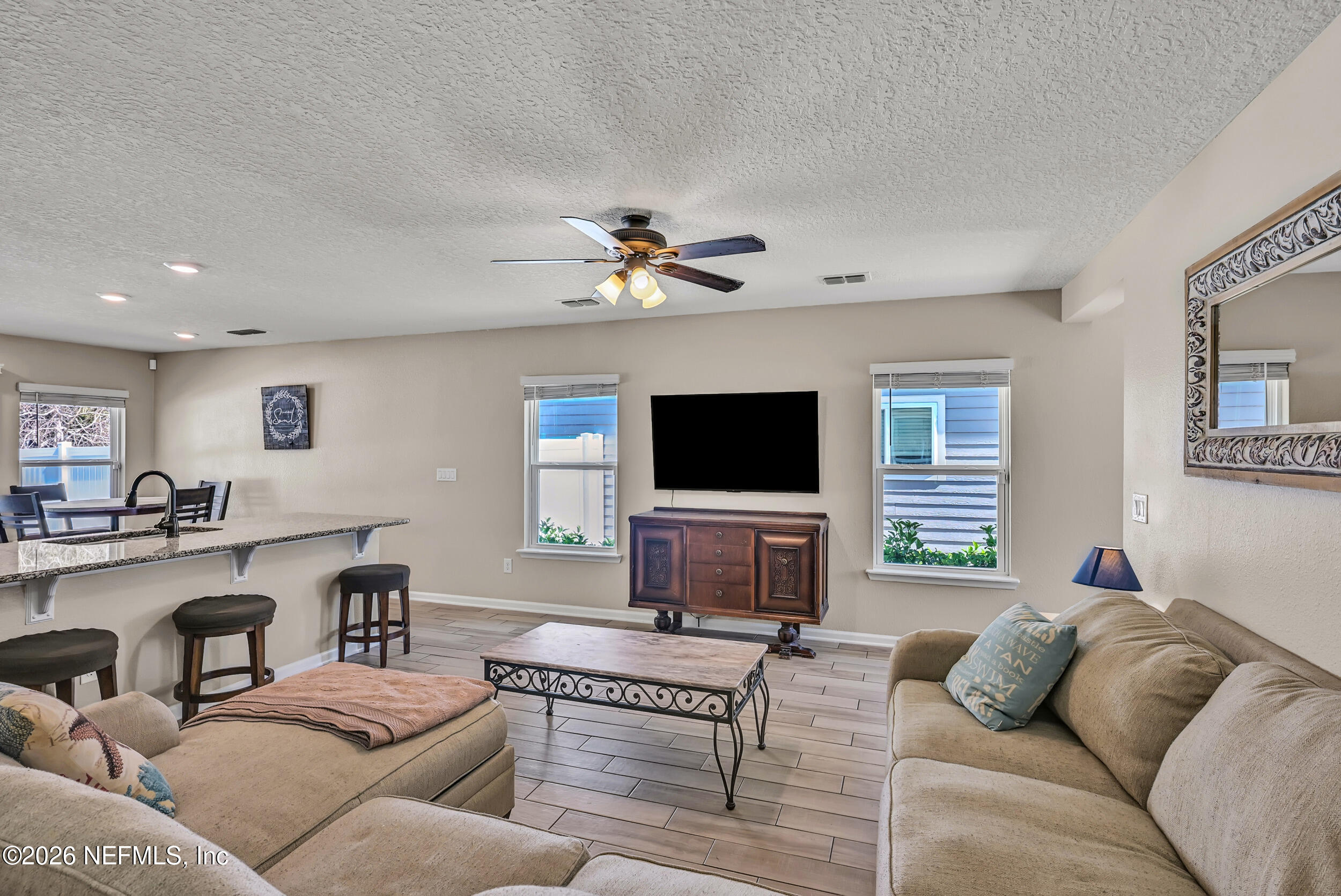 532 Bluejack Lane St. Augustine, FL 32095 - Photo 7 of 55 a living room with furniture and a flat screen tv