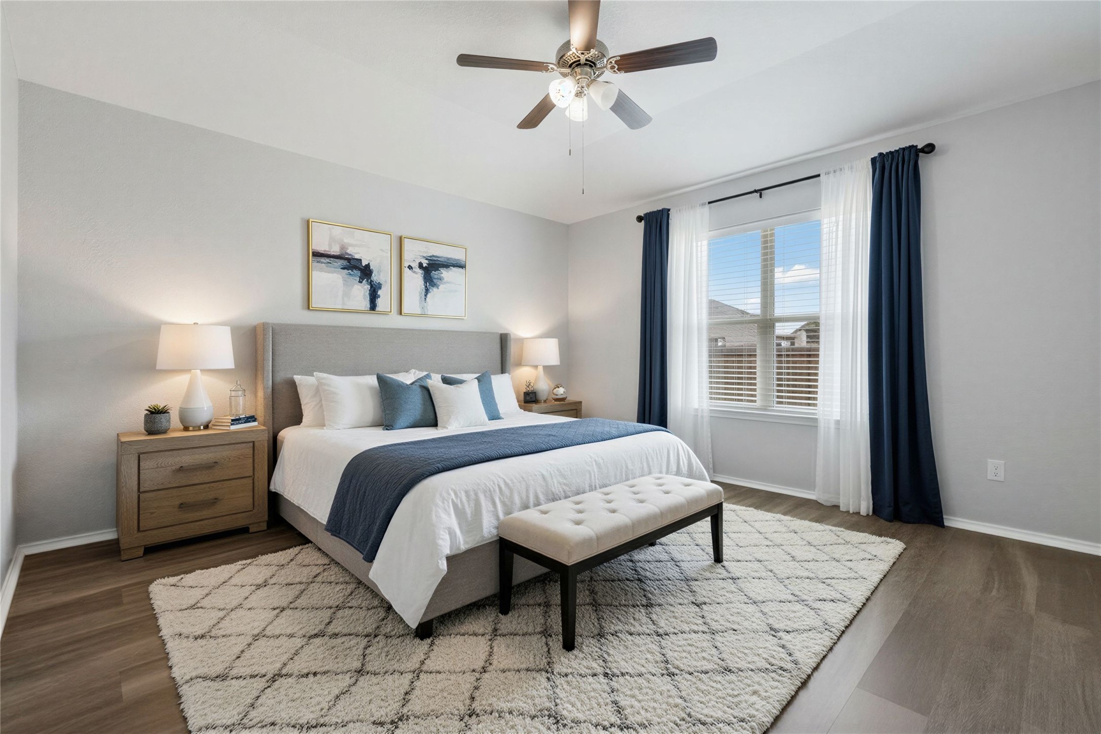 133 Beth Ann Loop Taylor, TX 76574 - Photo 12 of 30 Virtual stage main Bedroom with dark engineering flooring and ceiling fan