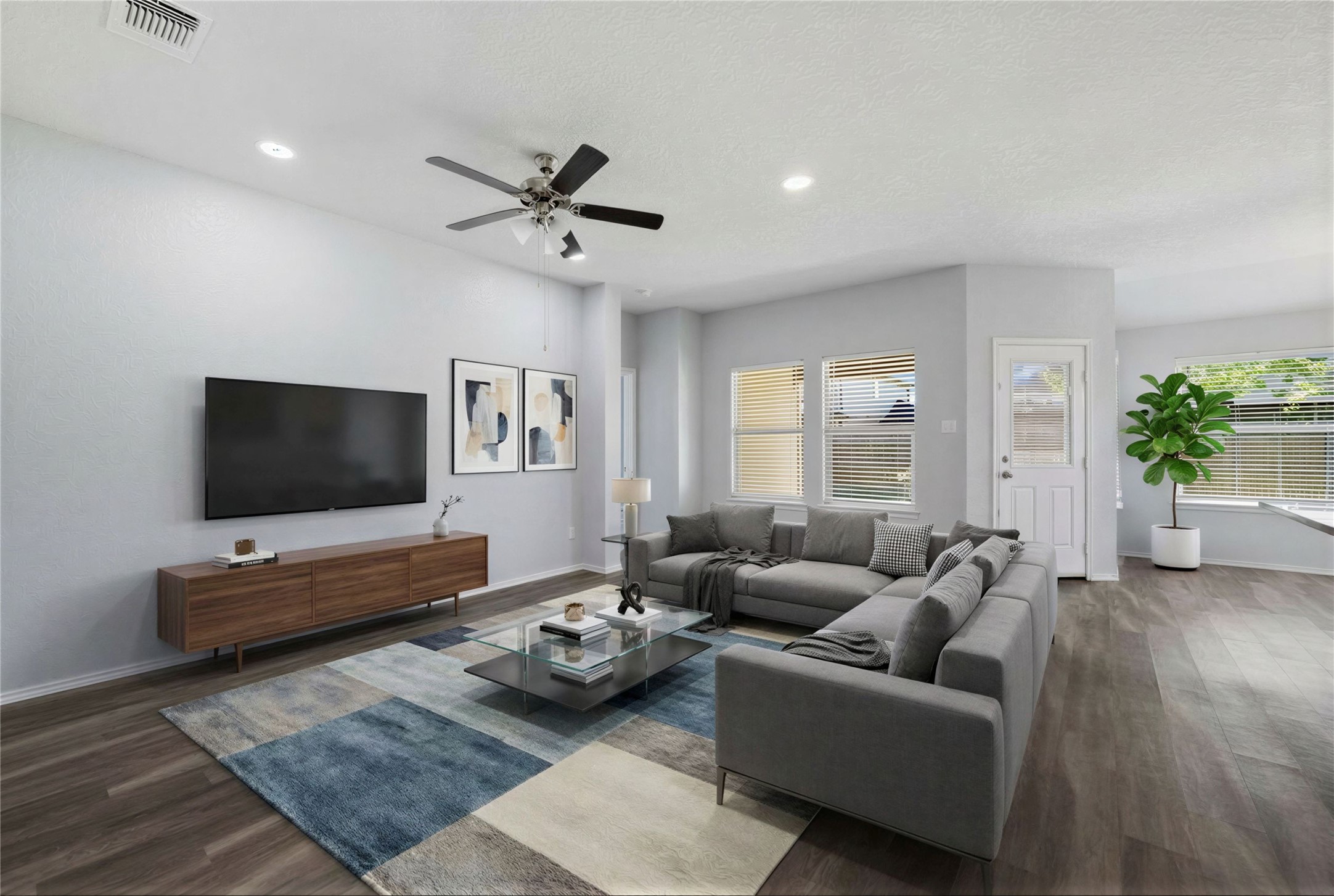 133 Beth Ann Loop Taylor, TX 76574 - Photo 3 of 30 Virtual stage Living area featuring dark engineering flooring a ceiling fan, healthy amount of natural light, and recessed lighting