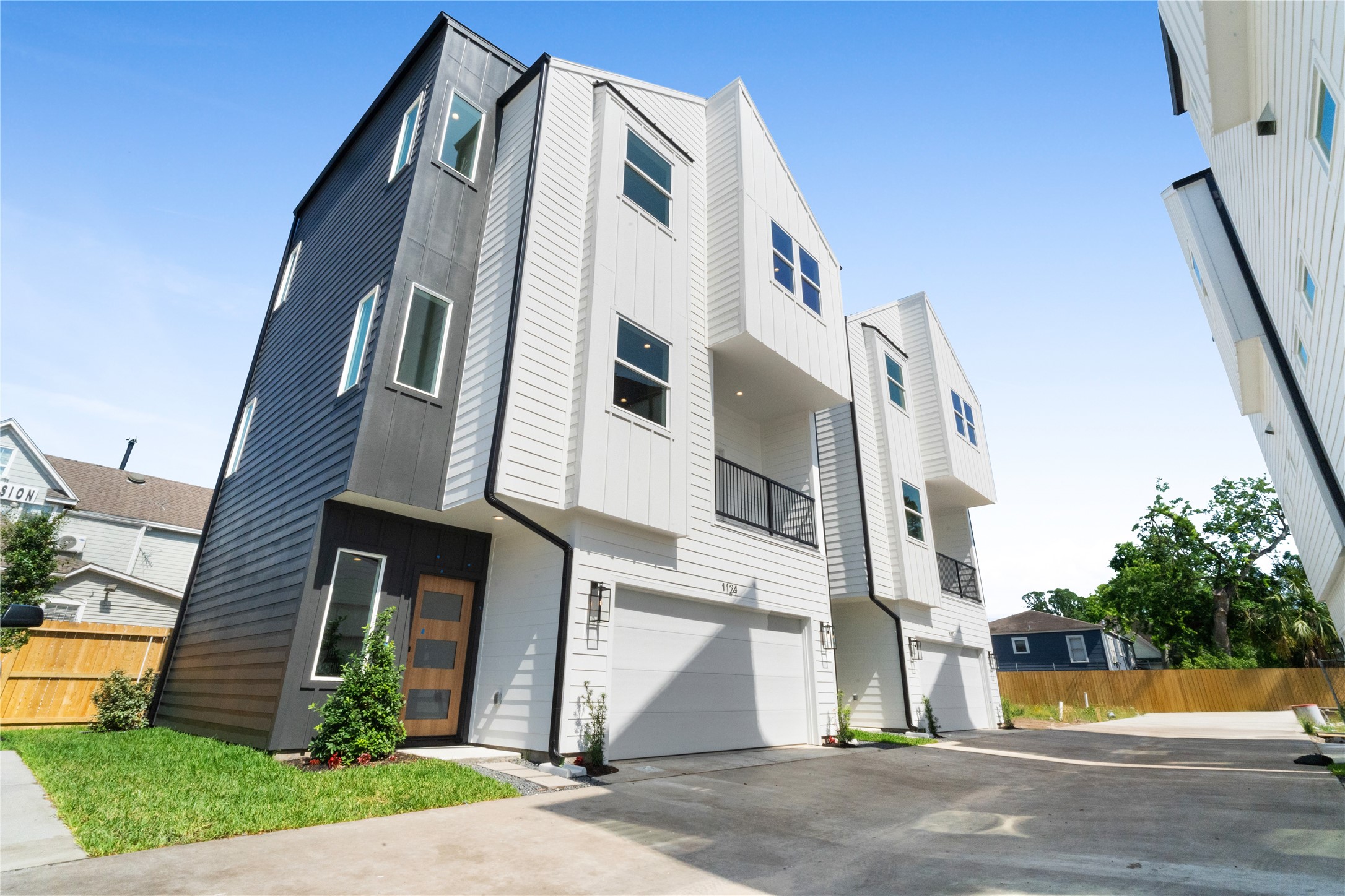 1112 Hogan Street Houston, TX 77009 - Photo 1 of 31 a view of a white building among the street