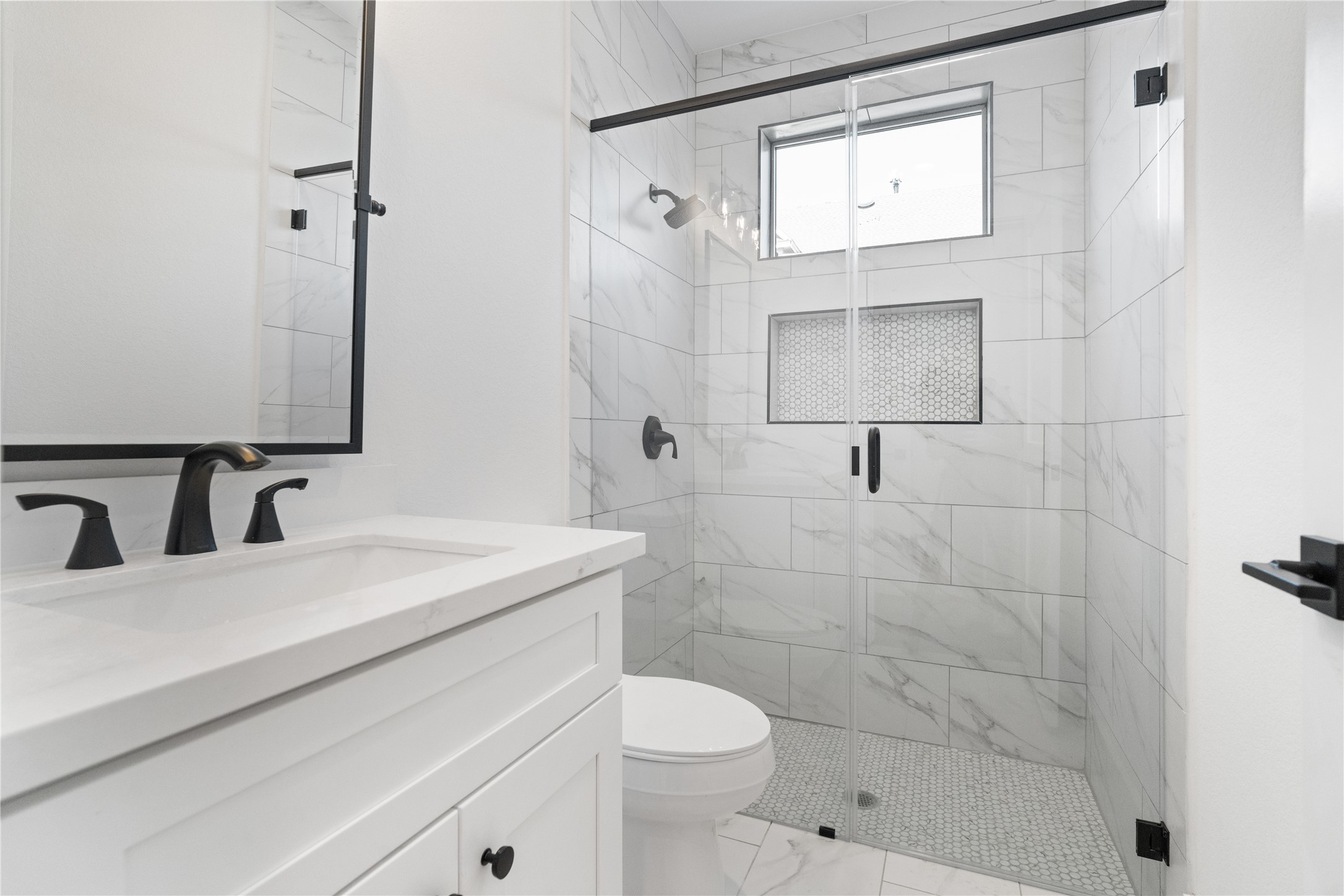1112 Hogan Street Houston, TX 77009 - Photo 20 of 31 a bathroom with a sink toilet and shower