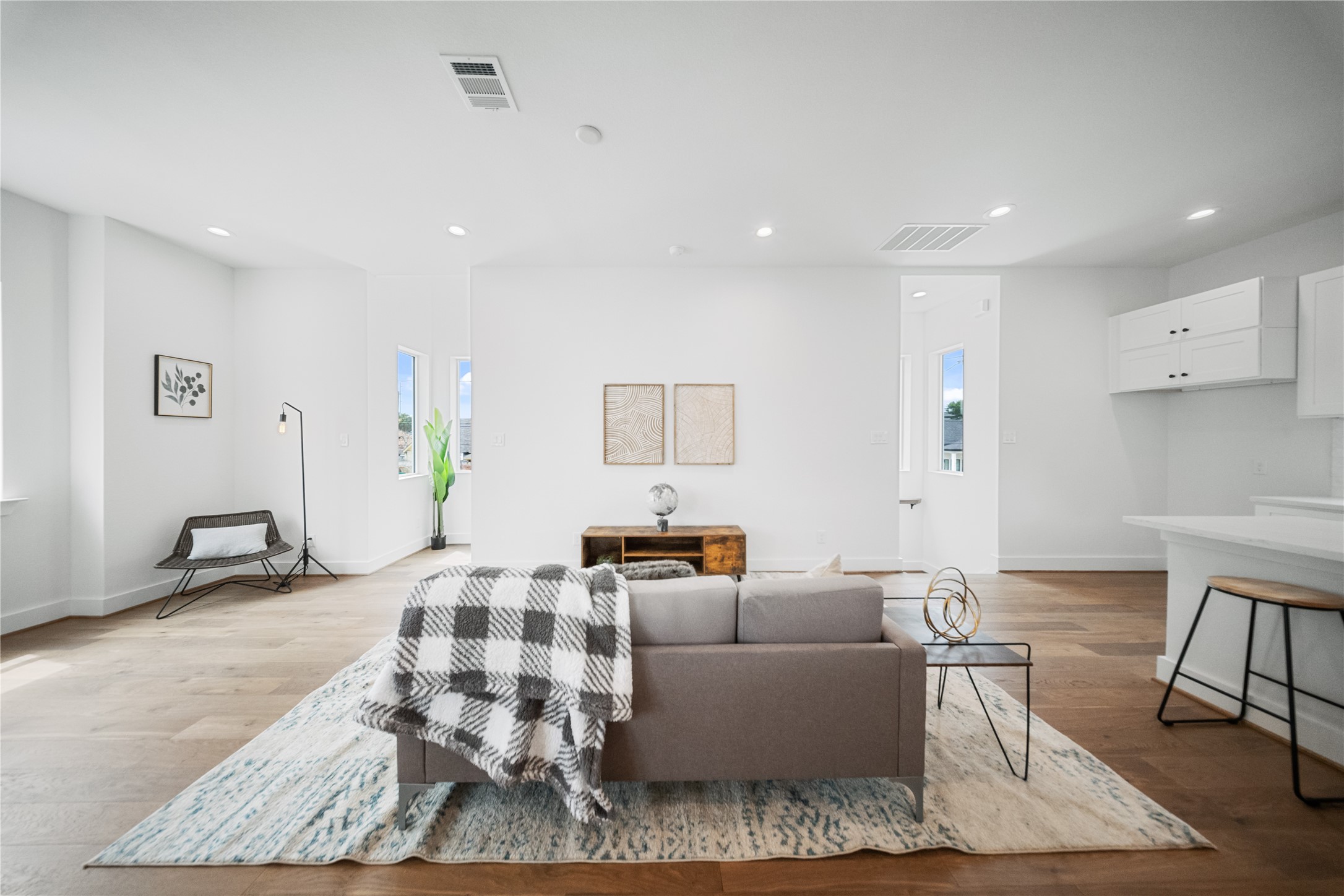 1112 Hogan Street Houston, TX 77009 - Photo 3 of 31 a living room with furniture and wooden floor