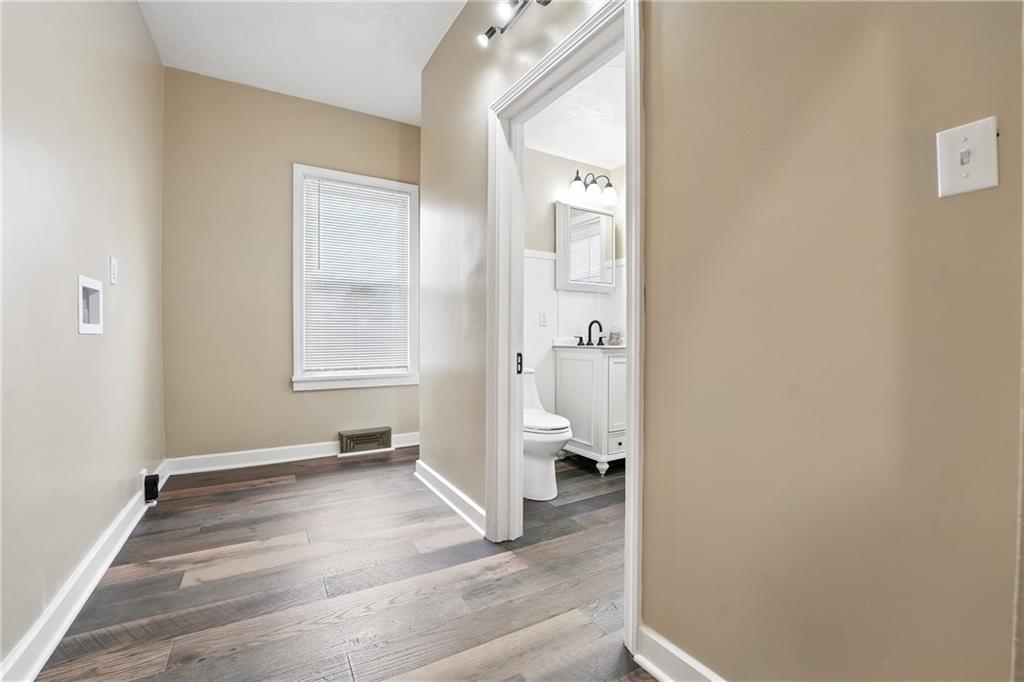1430 Old Butler Road New Castle, PA 16101 - Photo 15 of 31 a view of a room with wooden floor and a bathroom
