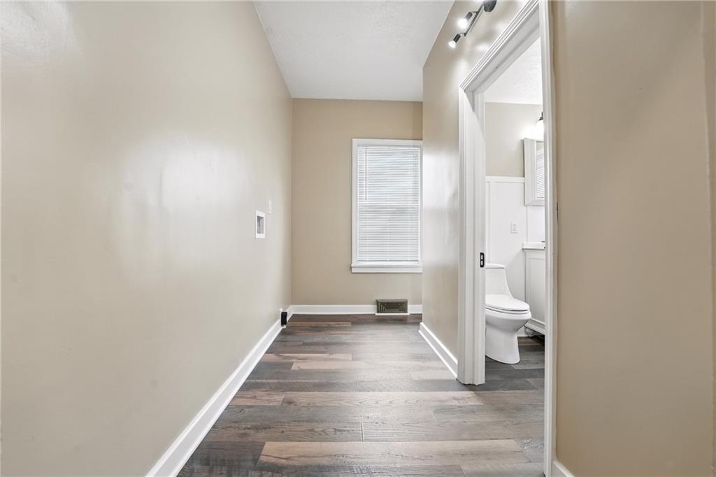 1430 Old Butler Road New Castle, PA 16101 - Photo 22 of 31 a view of a room with wooden floor and a bathroom
