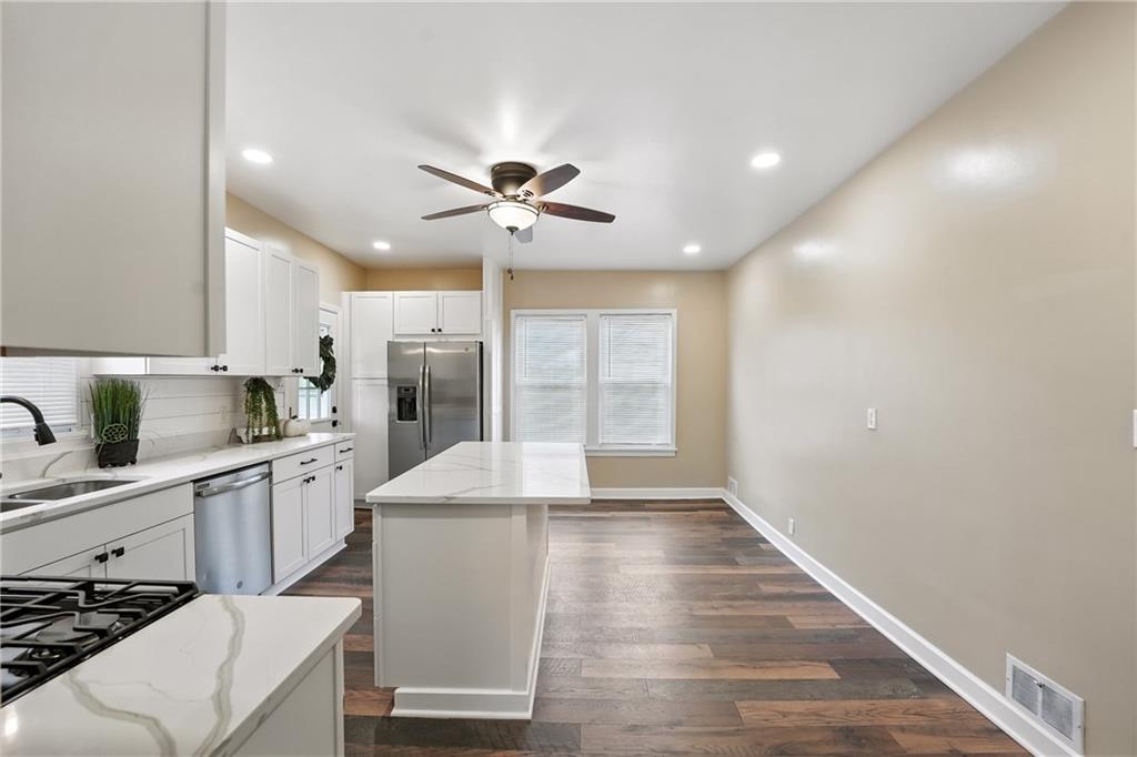 1430 Old Butler Road New Castle, PA 16101 - Photo 23 of 31 a large kitchen with kitchen island a sink stainless steel appliances and cabinets