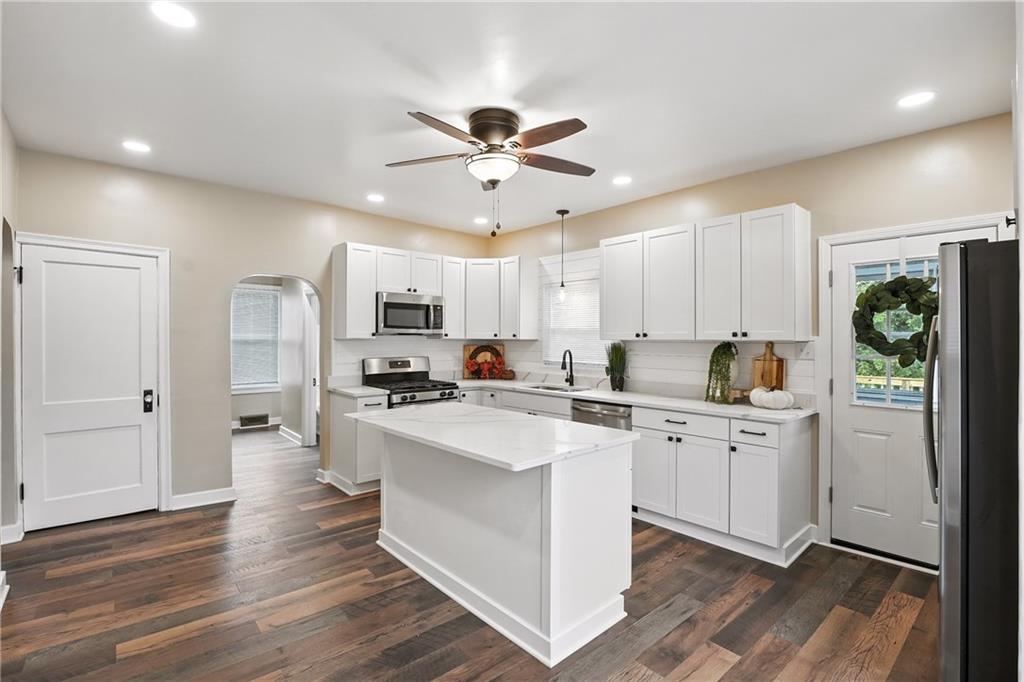 1430 Old Butler Road New Castle, PA 16101 - Photo 4 of 31 a kitchen with white cabinets and stainless steel appliances