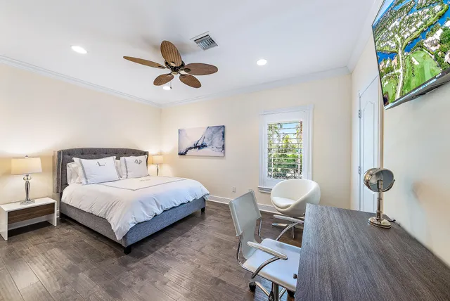 a bedroom with a bed and a chair