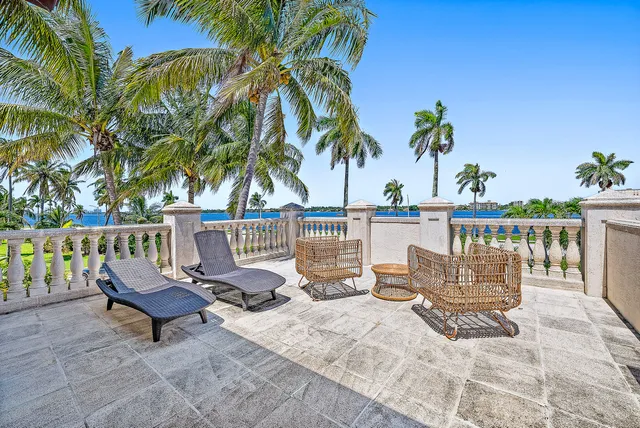 a view of a patio with a table and chairs