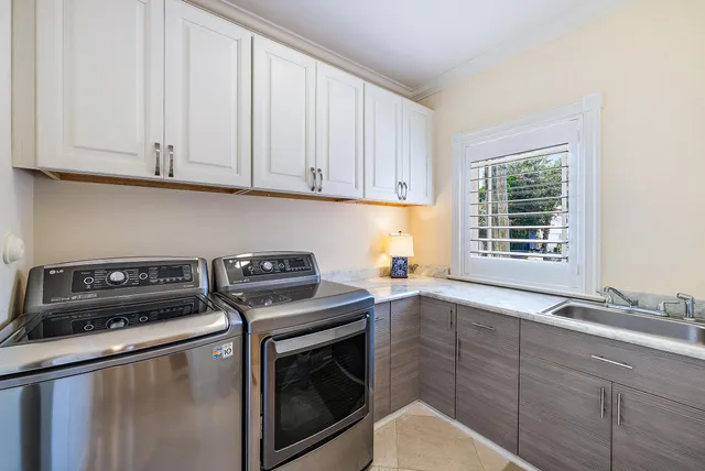 a kitchen with sink cabinets and window