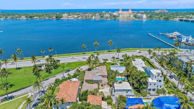 an aerial view of a house with a lake view