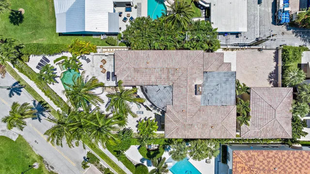 an aerial view of house with a yard