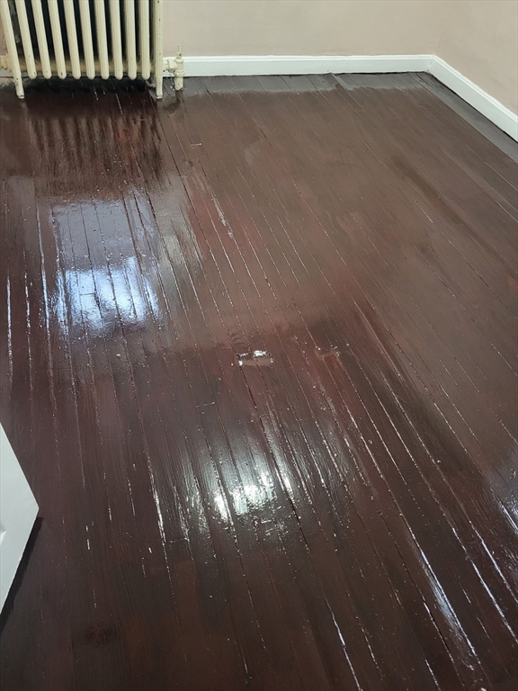 89 Oak Street Fall River, MA 02720 - Photo 16 of 39 a view of a room with wooden floor