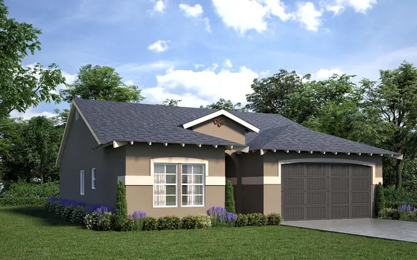 a front view of a house with a garden and yard