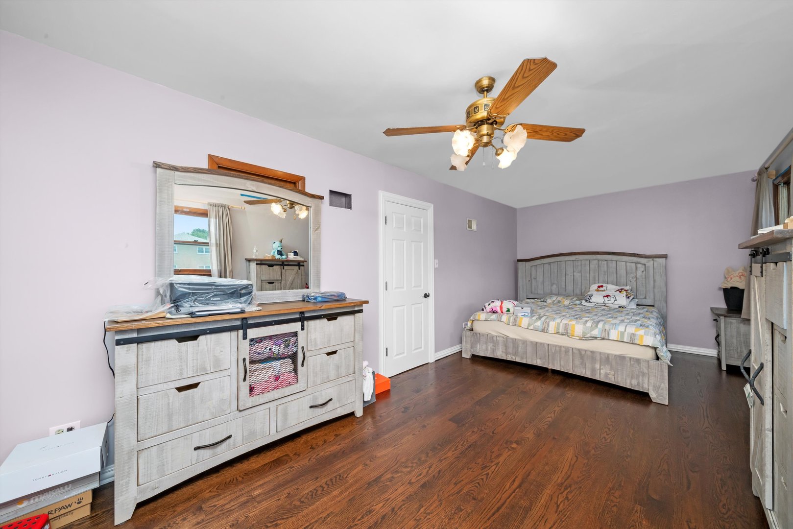 10529 Lyman Avenue Chicago Ridge, IL 60415 - Photo 31 of 45 a bedroom with a bed and a chandelier