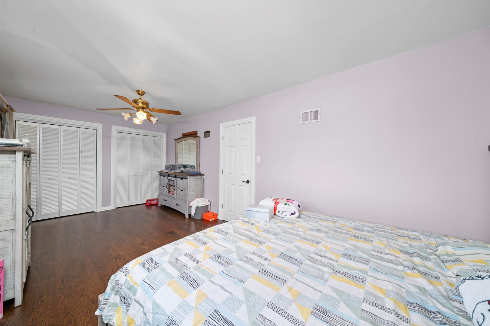 10529 Lyman Avenue Chicago Ridge, IL 60415 - Photo 32 of 45 a bedroom with a bed and a chandelier