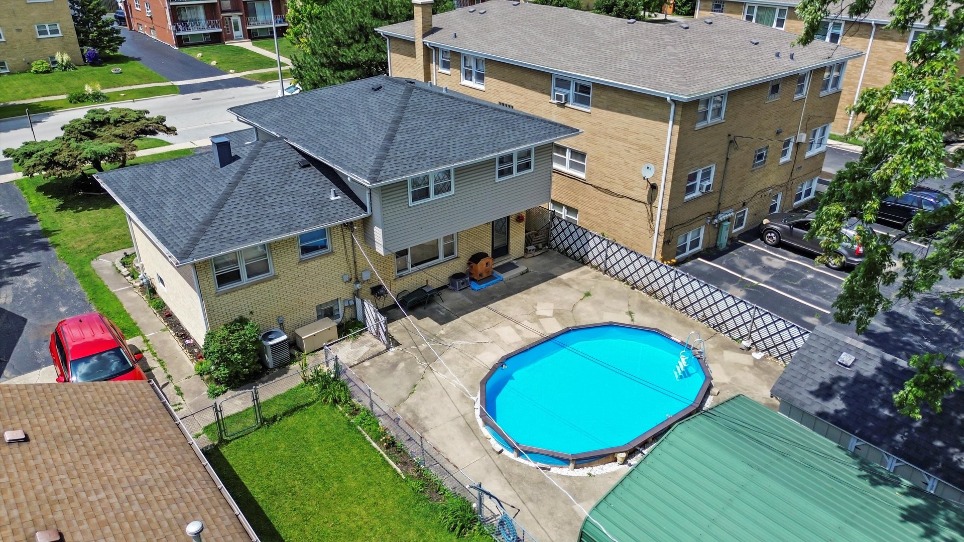 10529 Lyman Avenue Chicago Ridge, IL 60415 - Photo 9 of 45 an aerial view of a house with a swimming pool and a yard