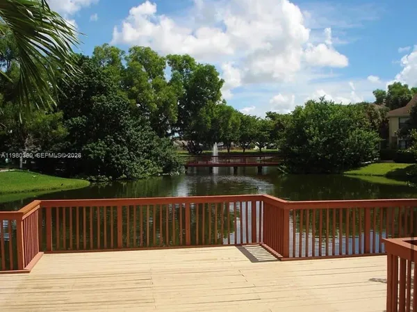 a view of balcony with wooden floor