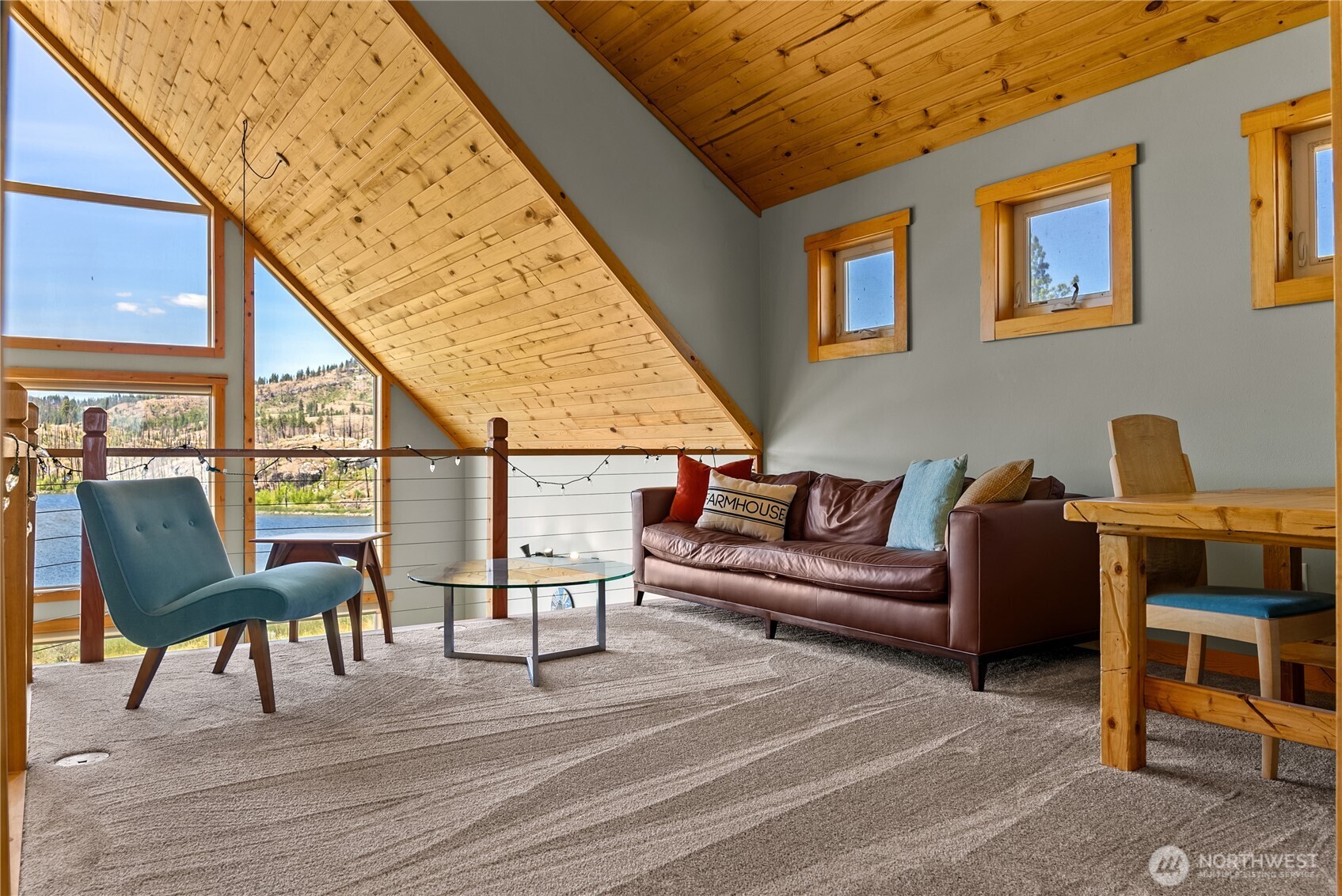 30 Shalberg Lake Road Riverside, WA 98849 - Photo 14 of 40 a balcony with wooden floor and outdoor seating