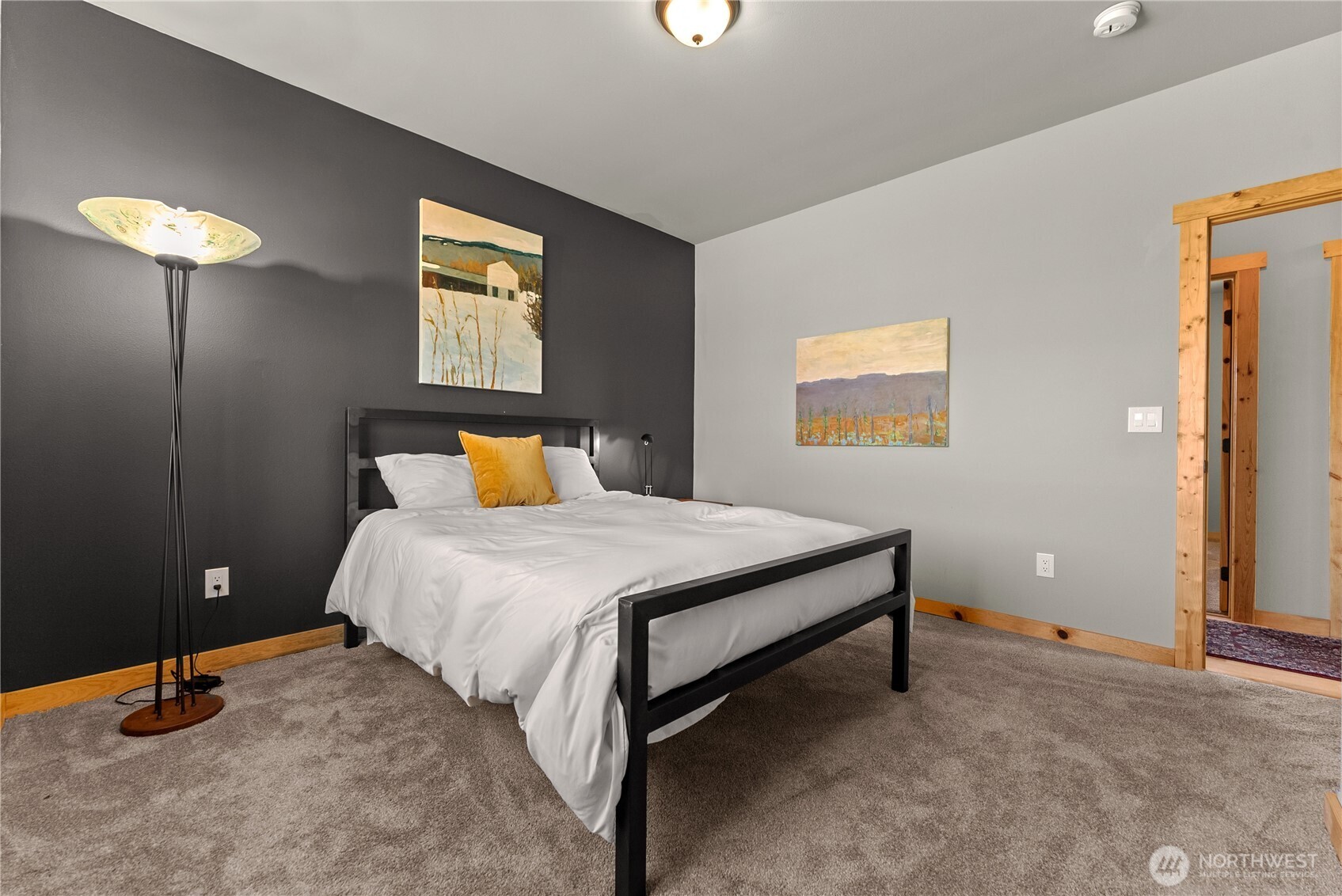 30 Shalberg Lake Road Riverside, WA 98849 - Photo 23 of 40 a bedroom with a bed and a lamp on table