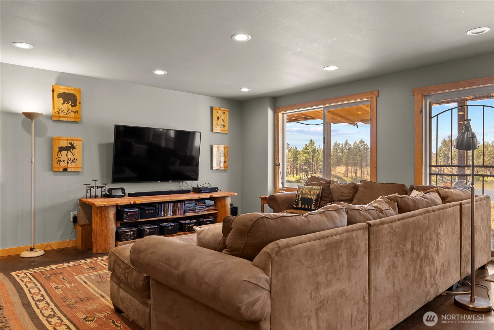 30 Shalberg Lake Road Riverside, WA 98849 - Photo 26 of 40 a living room with furniture and a flat screen tv