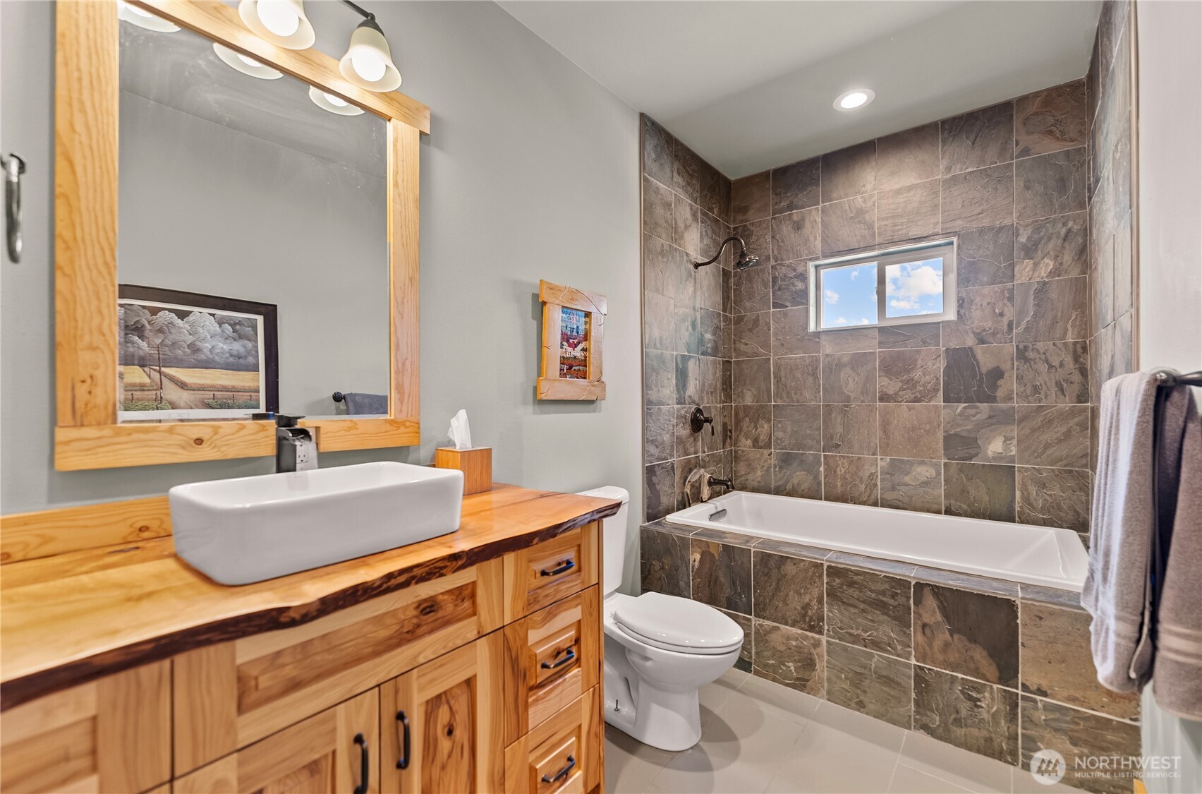 30 Shalberg Lake Road Riverside, WA 98849 - Photo 31 of 40 a bathroom with a sink a toilet a mirror a bathtub and shower