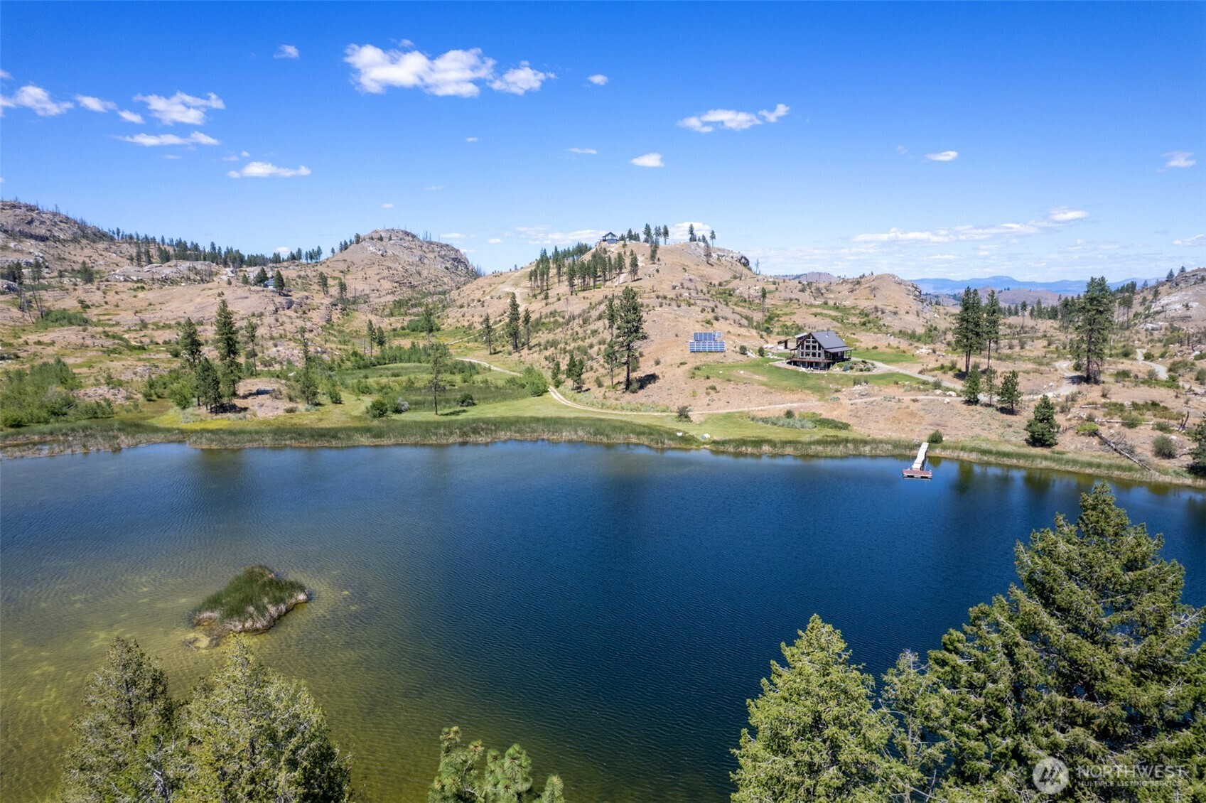 30 Shalberg Lake Road Riverside, WA 98849 - Photo 38 of 40 a view of a lake with a mountain