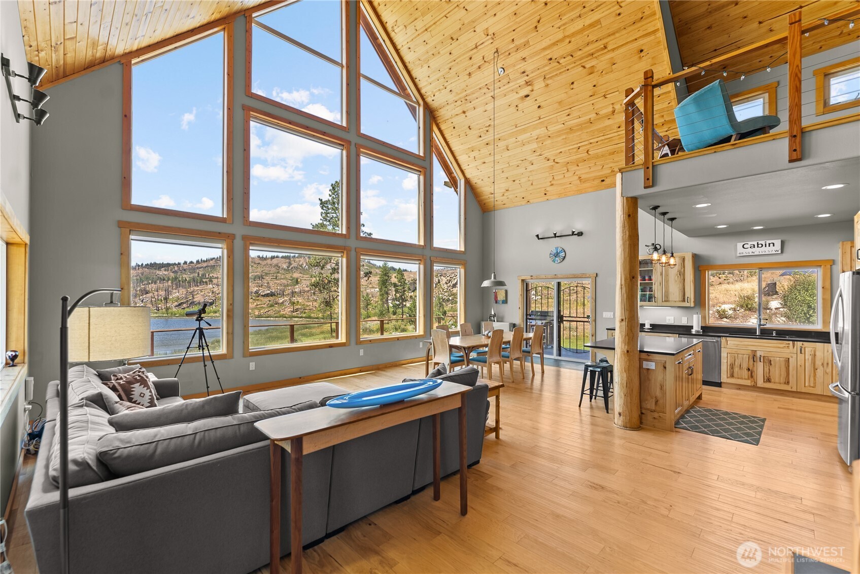 30 Shalberg Lake Road Riverside, WA 98849 - Photo 4 of 40 a living room with furniture water chandelier and large windows