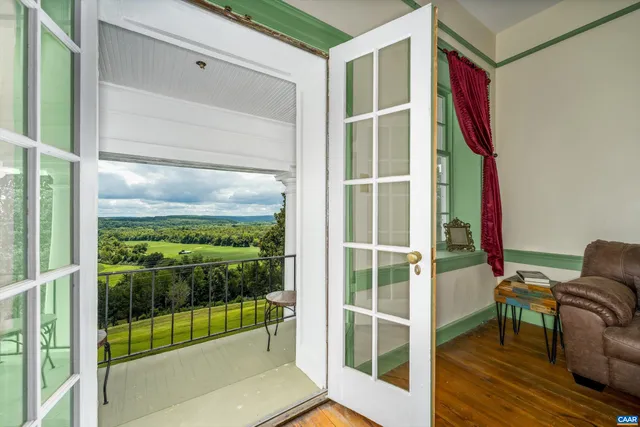 a view of a garden with large trees