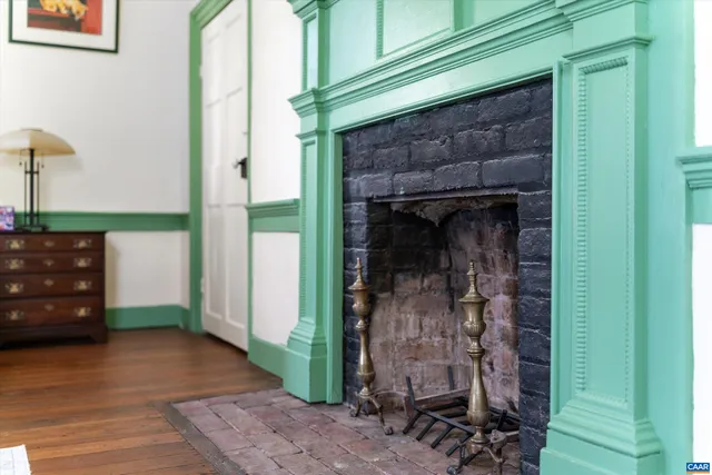 a view of a livingroom with furniture and a kitchen