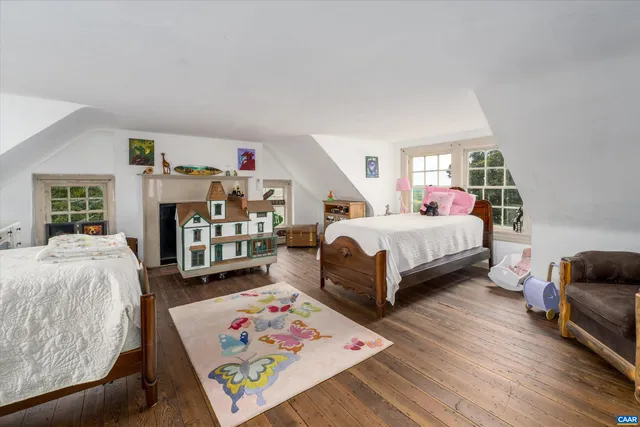 a view of a livingroom with furniture and a fireplace