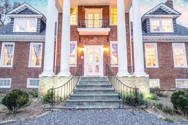 a front view of a house with a outdoor view and windows