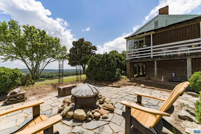 a sign broad in front of the tree