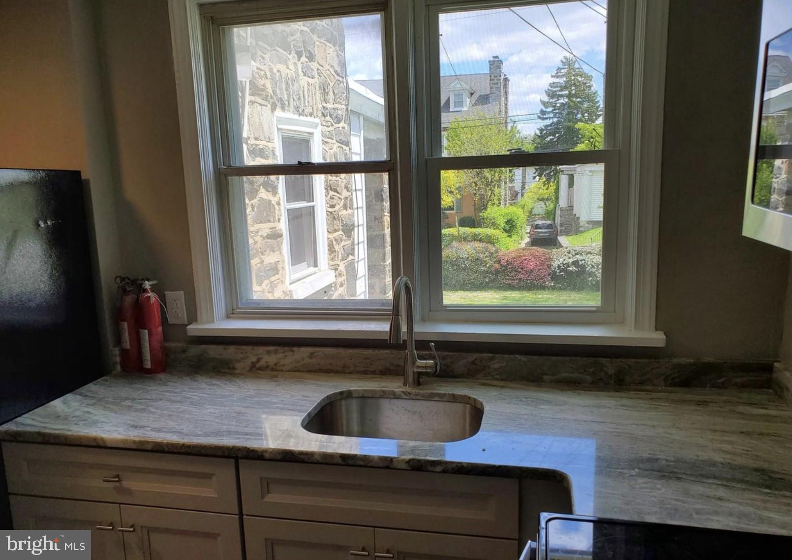 38 Copley Road Upper Darby, PA 19082 - Photo 16 of 22 a bathroom with a sink and a window