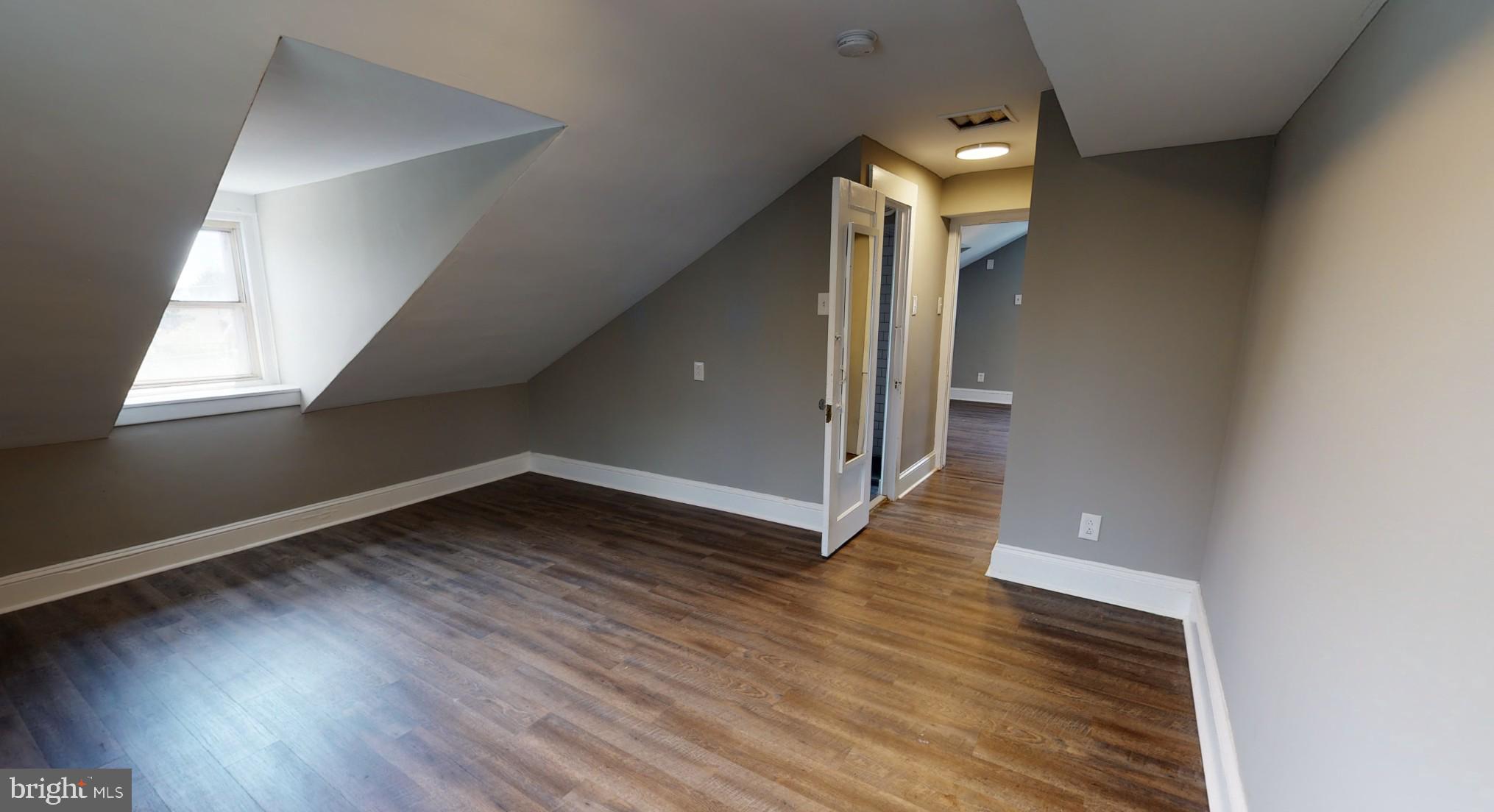 38 Copley Road Upper Darby, PA 19082 - Photo 5 of 22 a view of entryway and hall with wooden floor
