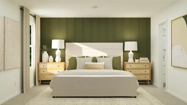 a bedroom with a bed and a painting on the wall