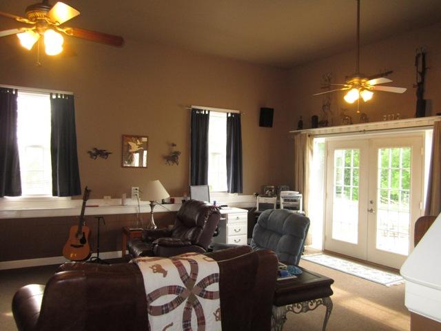 7761 Shoals Branch Road Primm Springs, TN 38476 - Photo 11 of 20 Walk out the den & enjoy sitting on the patio & watching horses in the arena.