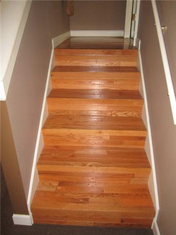 7761 Shoals Branch Road Primm Springs, TN 38476 - Photo 12 of 20 Glowing hardwood steps lead to Den from the Kitchen. There was no expense spared in making this home a true showplace.