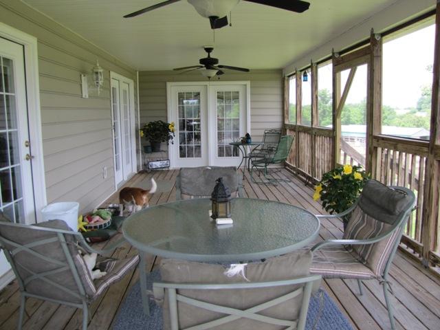 7761 Shoals Branch Road Primm Springs, TN 38476 - Photo 14 of 20 Feel the breezes & enjoy watching the horses & turkey with no bugs to worry about from this large screened porch. This porch is accessible from the Master Bedroom also. True relaxation here!
