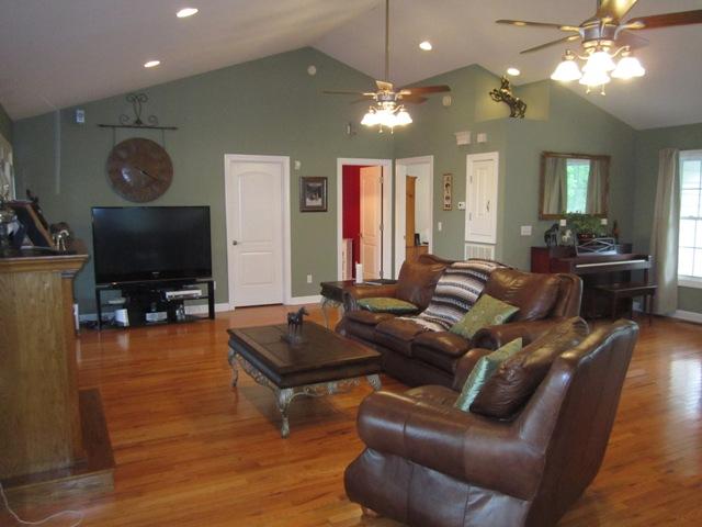 7761 Shoals Branch Road Primm Springs, TN 38476 - Photo 3 of 20 Vaulted ceilings, fresh paint in decorator colors, gleaming true sand & stain hardwood floors, can lighting & tasteful ceiling fans make this Living Room stunning.